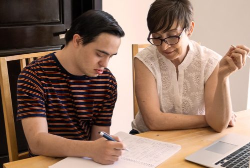 little-treasures-therapy-mom-and-son-working-on-bills